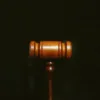 Judge's Gavel on top of a black background.